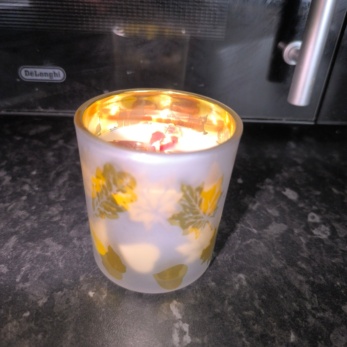 Candles in a cute leaf glass.