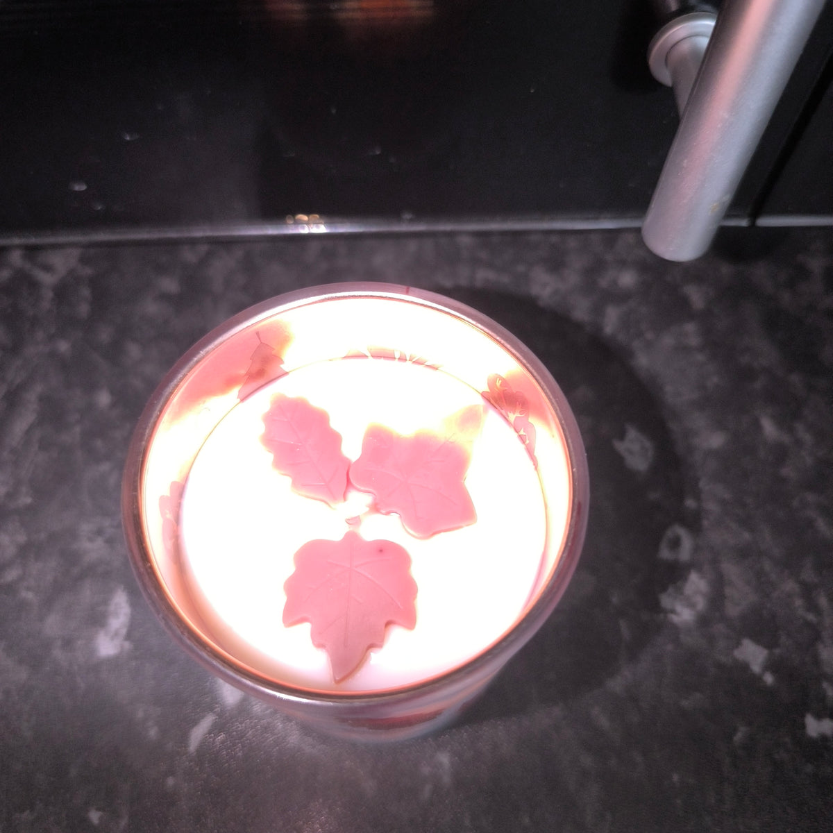 Candles in a cute leaf glass.