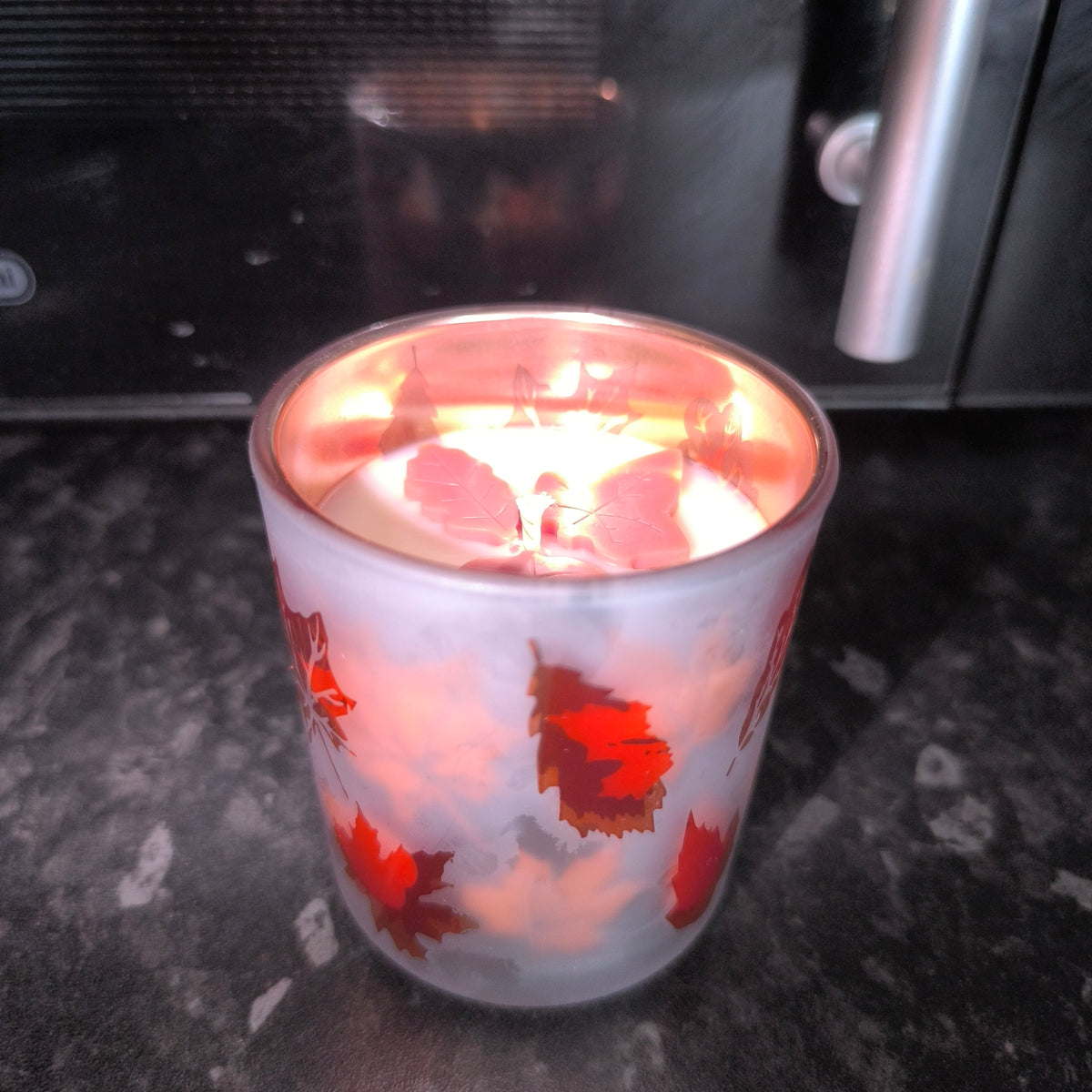 Candles in a cute leaf glass.