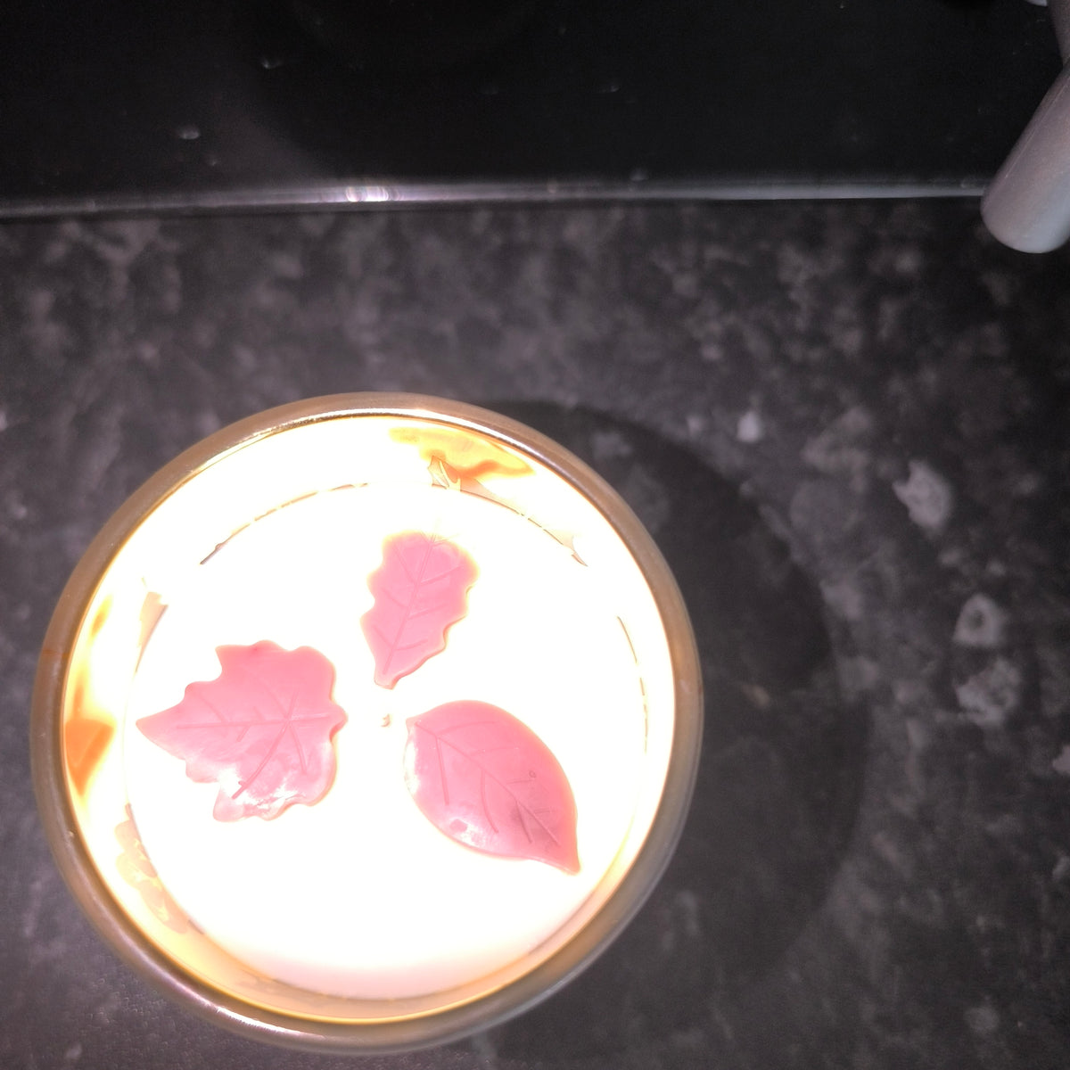 Candles in a cute leaf glass.